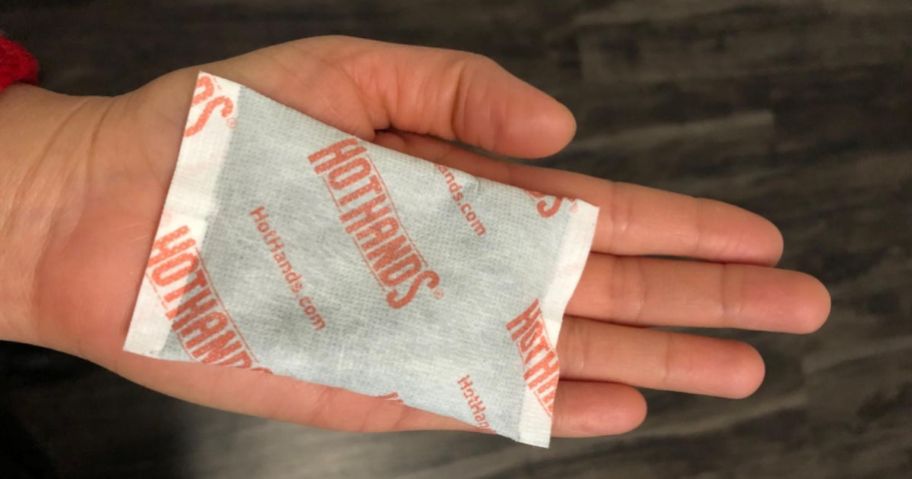 holding a Hot Hands hand warmer