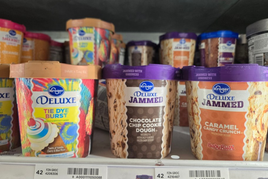 pints of kroger brand ice cream lined up in the freezer case