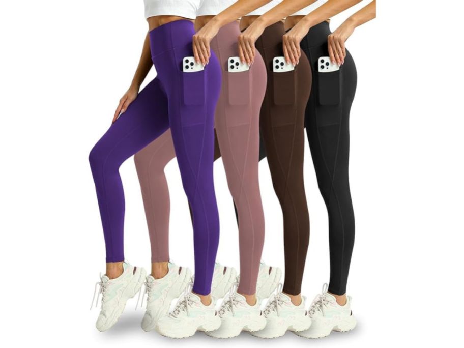 four women wearing leggings and putting phone in side pockets