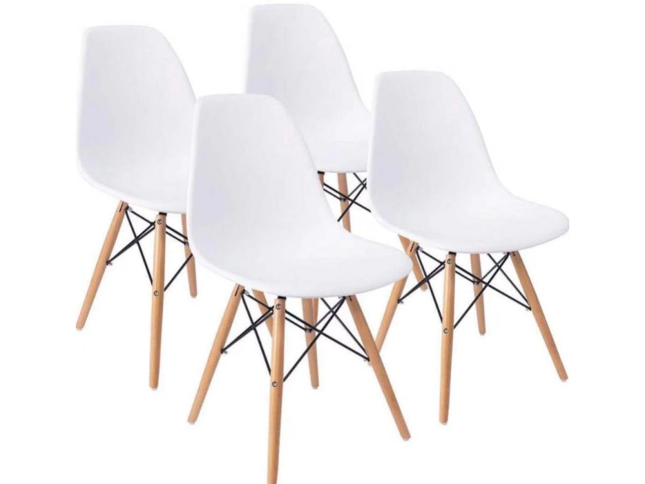 4 white dining chairs with wooden legs 