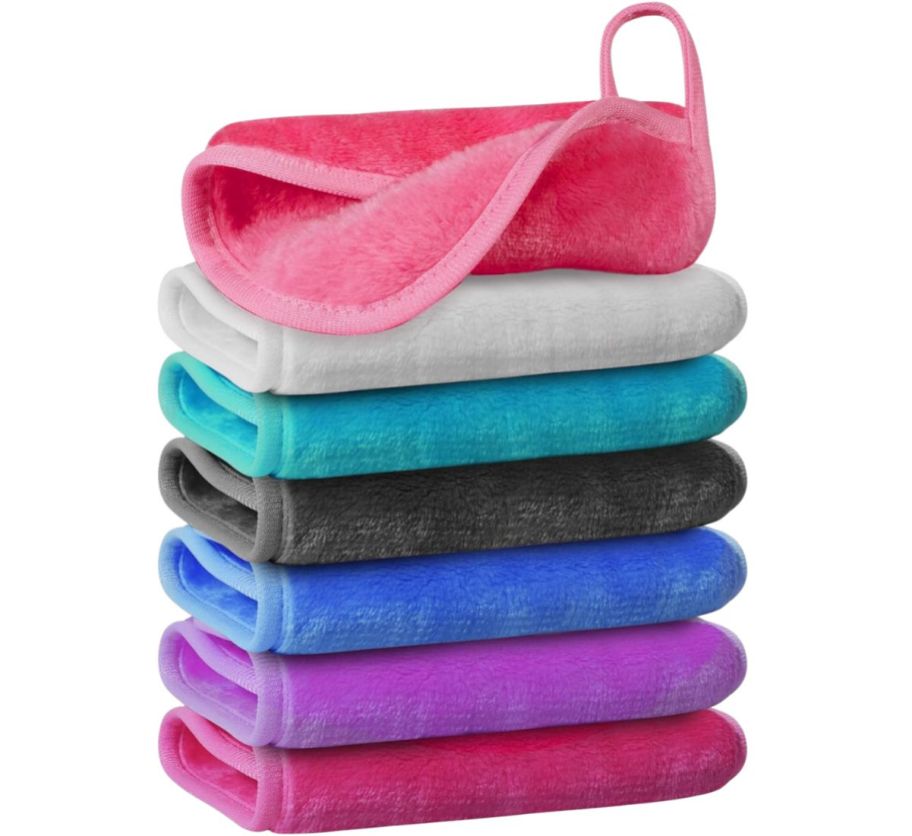 a 7 piece stack of makeup remover cloths in various colors folded and stacked