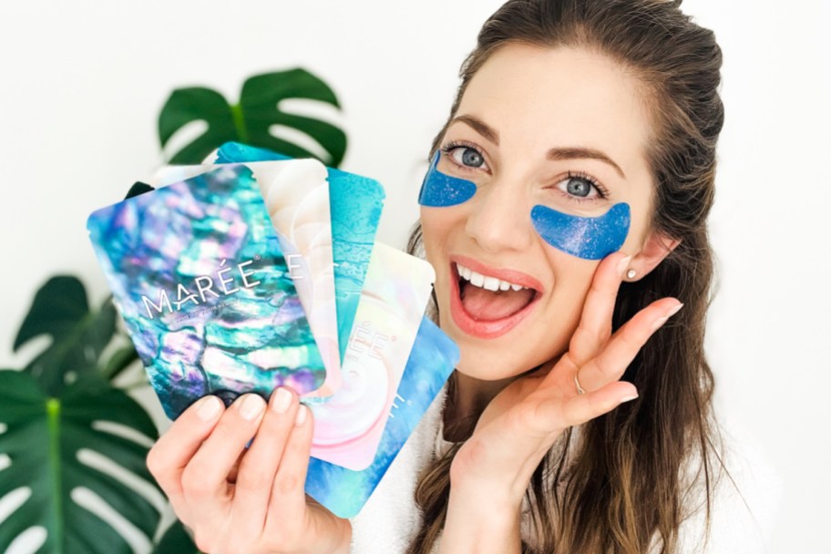 sara wearing blue eye gels holding packages