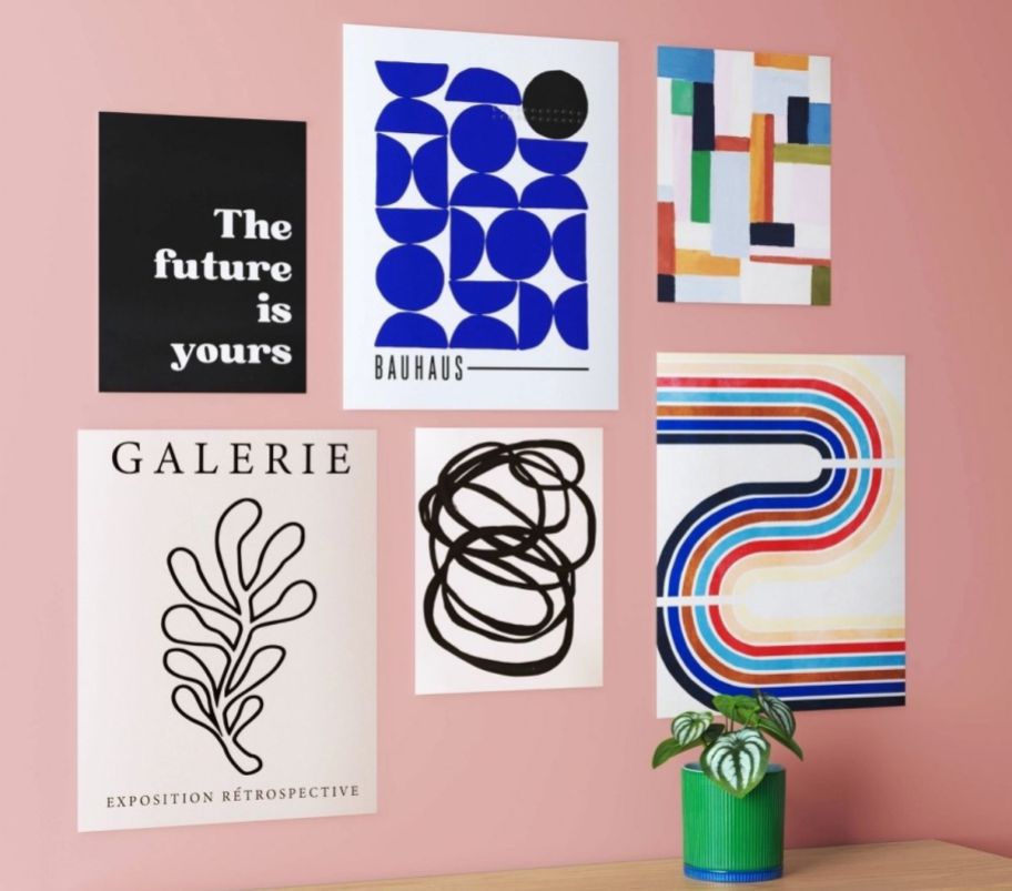 6 graphic posters in various sizes arranged on a wall