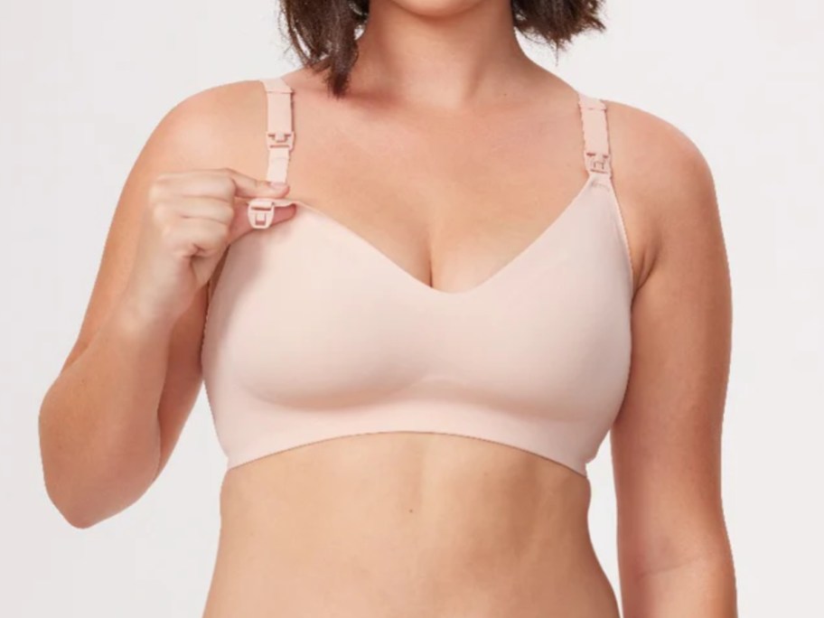 woman wearing a light pink nursing bra
