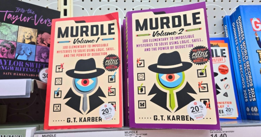 2 Murdle mystery puzzle books on a store shelf