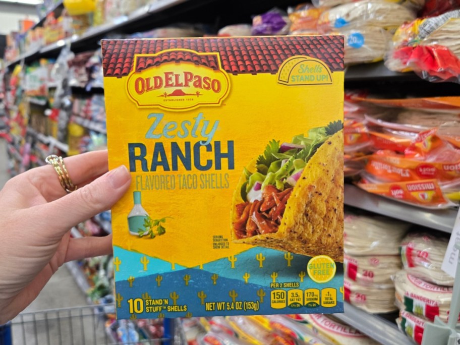 hand holding a box of Old El Paso Stand ‘N Stuff Crunchy Taco Shells, Zesty Ranch 