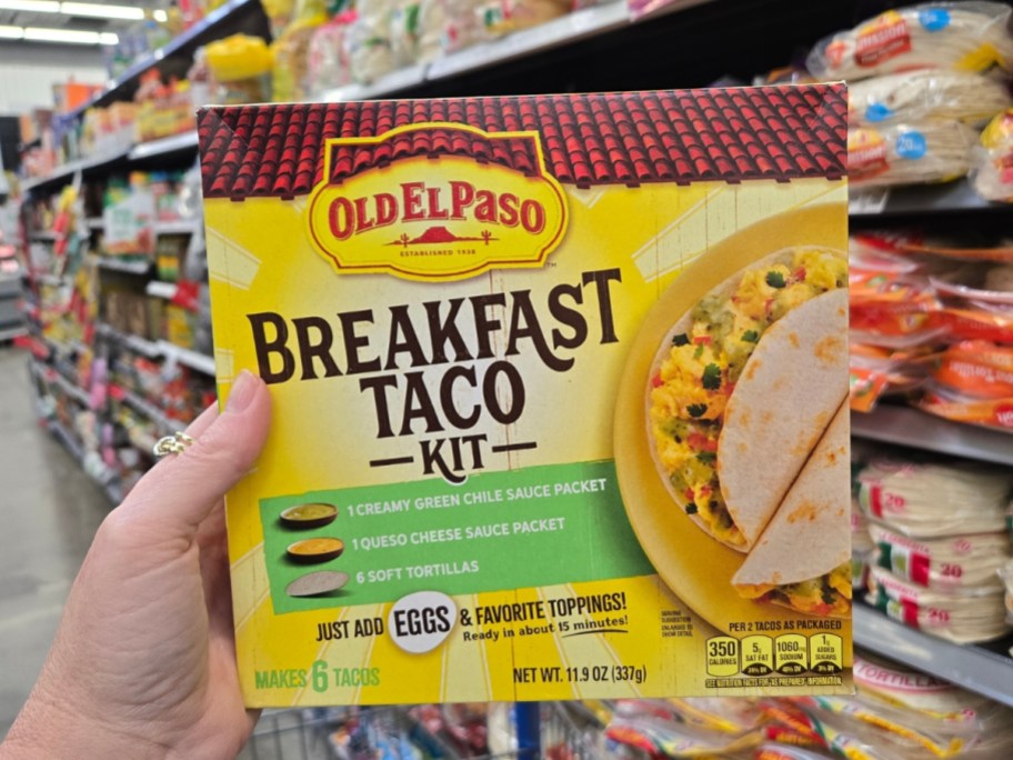 hand holding an Old El Paso Breakfast Taco Kit box in a store aisle