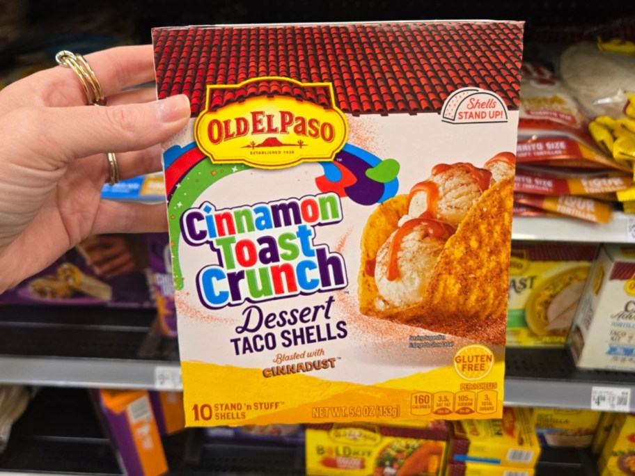 hand holding a box of Old El Paso Cinnamon Toast Crunch Taco Shells
