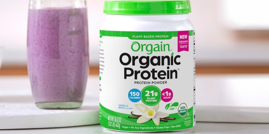 orgain protein powder container on counter