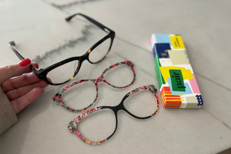 pair glasses frames and two toppers