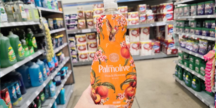 hand holding peach palmolive dish soap