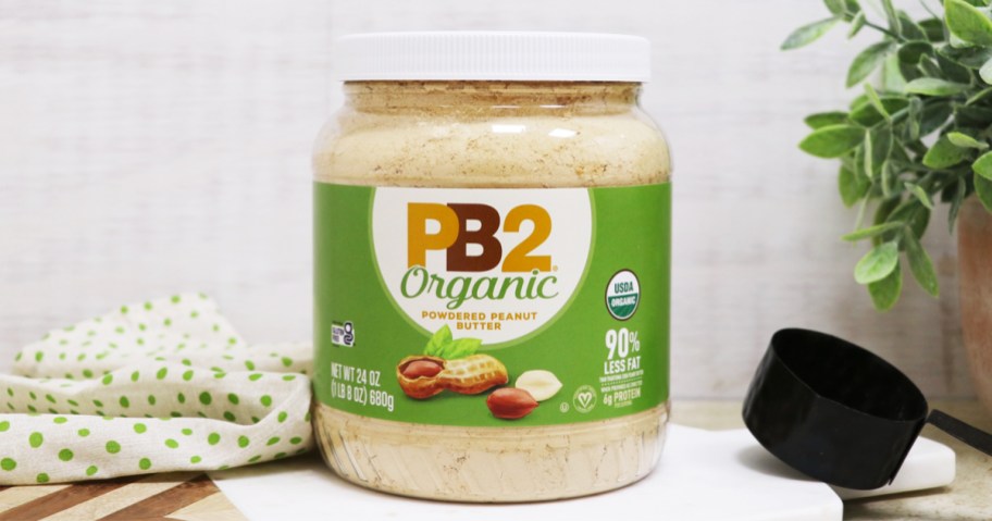 jar of pb2 organic peanut butter powder on a counter