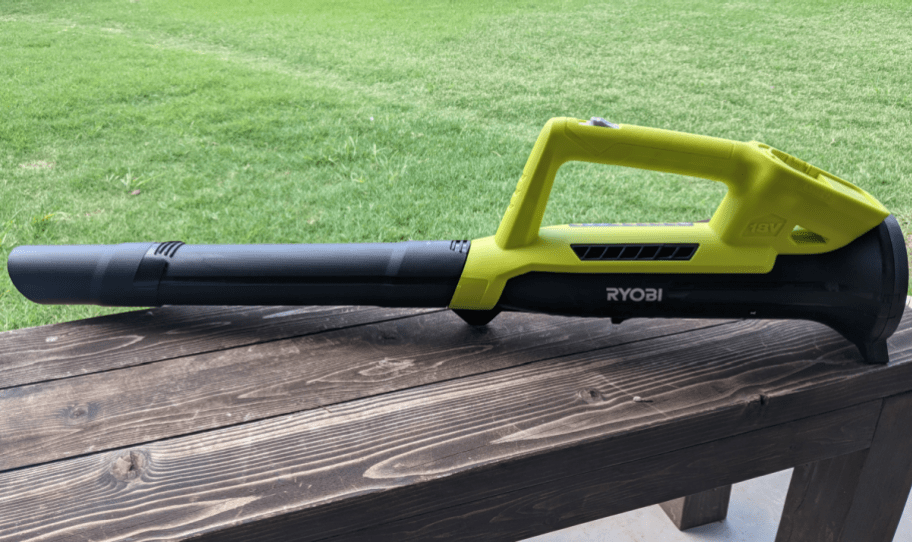 leaf blower sitting on bench outside