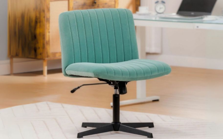 a green velvet armless office chair