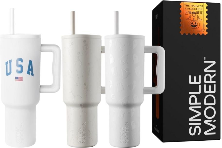 three white 40oz simple modern graphic tumblers with lids and straws
