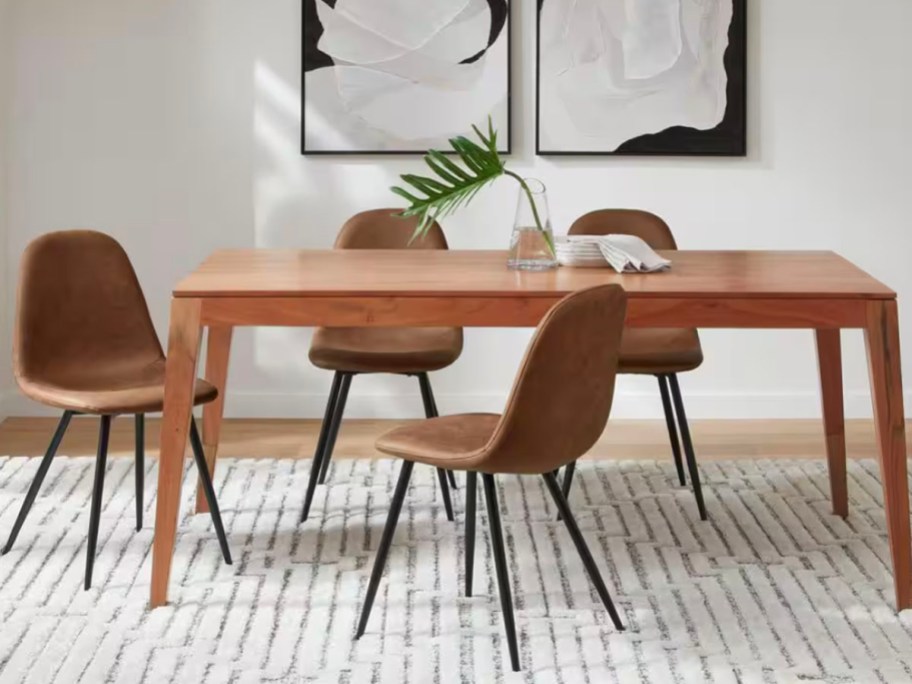 wood dining table with faux leather chairs 