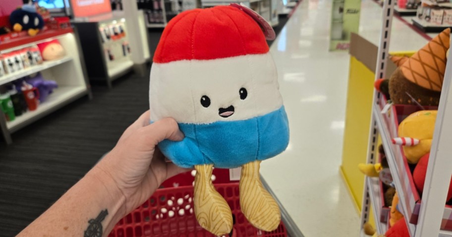 hand holding a red, white, and blue popsicle plush