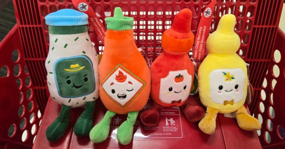 four different plush condiment toys sitting in a Target cart