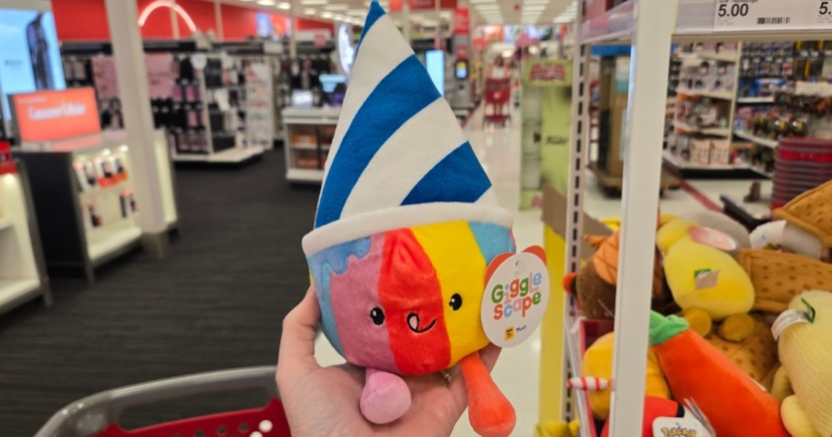 hand holding a frozen yogurt plush toy