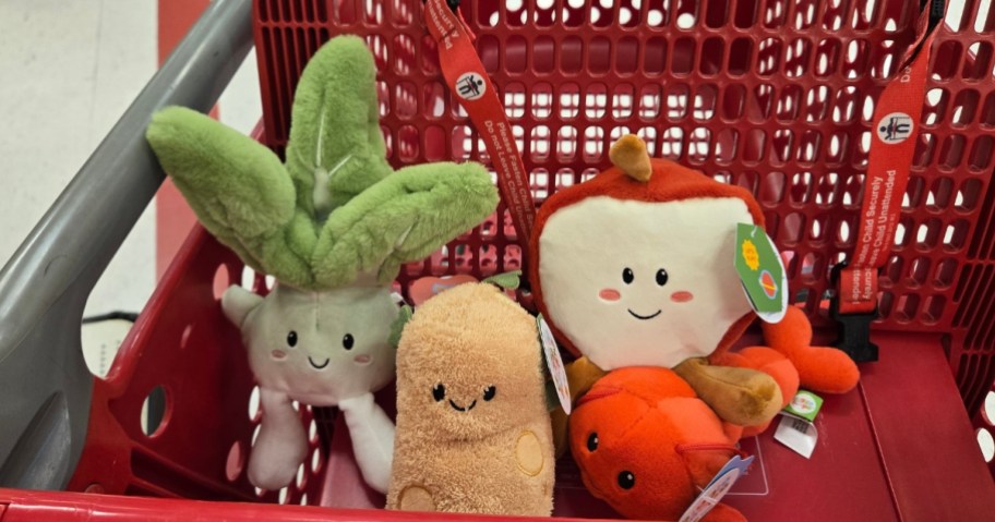 3 plush toys in a Target cart - a celery stalk, a potato, an open apple, and a lobster plush