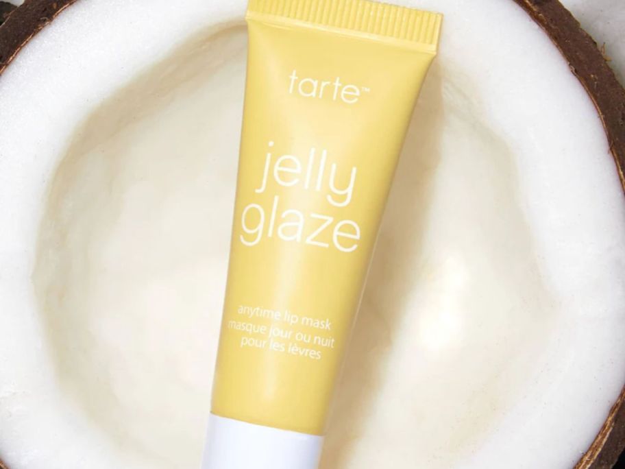 Tarte Jelly Glaze Lip Mask in Toasted Coconut in a fresh cut coconut