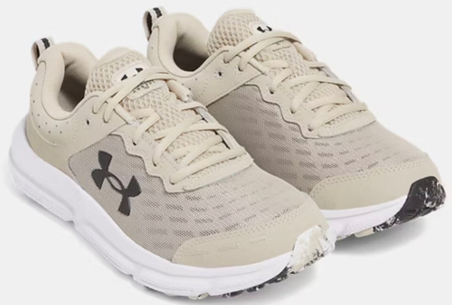 pair of tan under amour shoes 