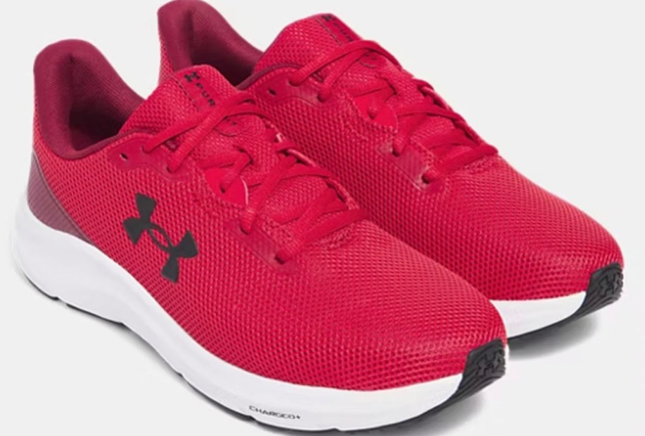 pair of red under armour shoes 