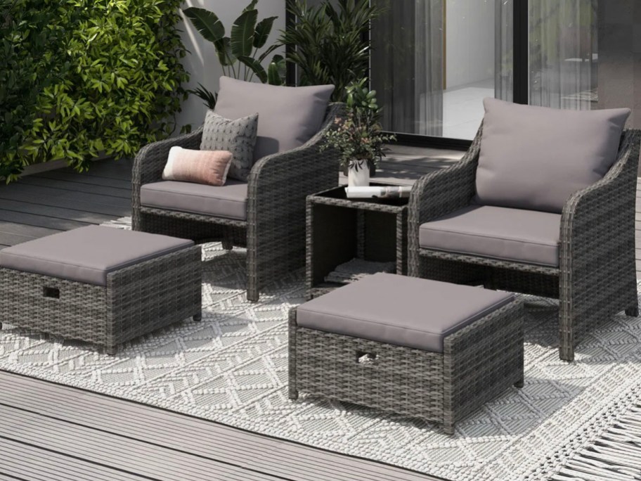 black and gray patio chairs and table outdoors 