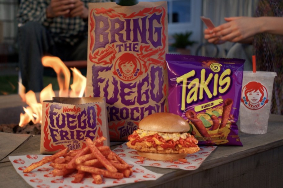 chicken sandwich and fries next to takis bag