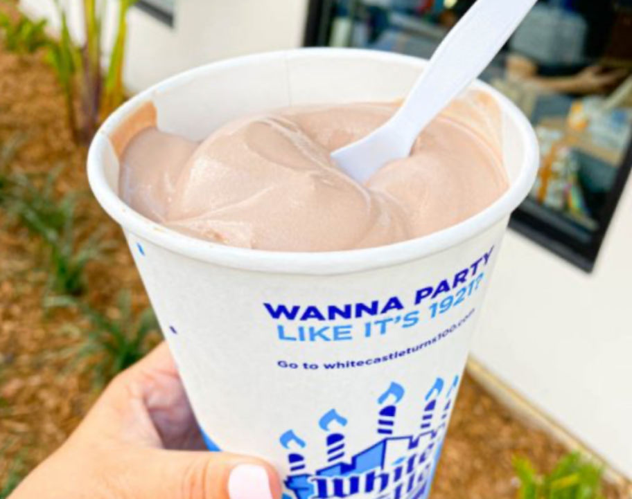 holding a White Castle milkshake