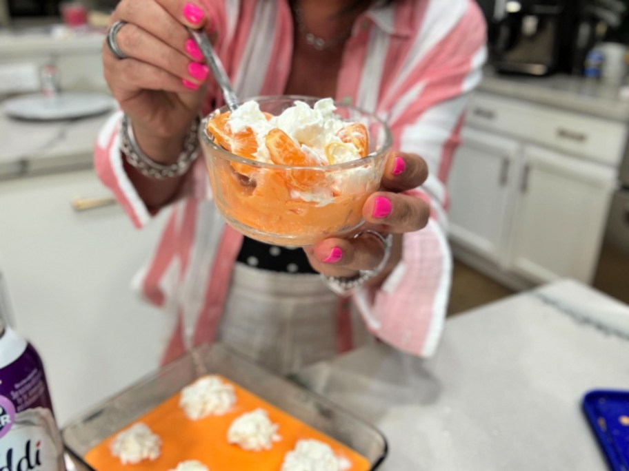 woman with small glass of protein jello